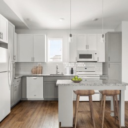 kitchen with ample counter-space, modern appliances and bright lighting