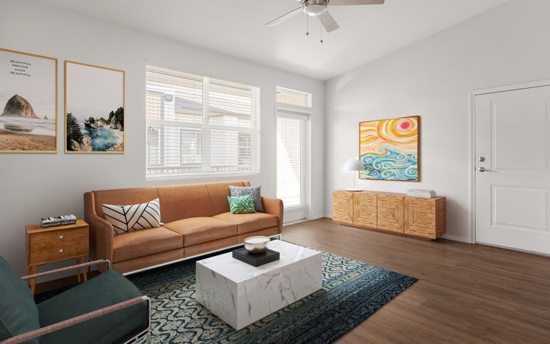 a living room with a couch and a fan