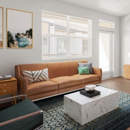 a living room with a couch and a fan